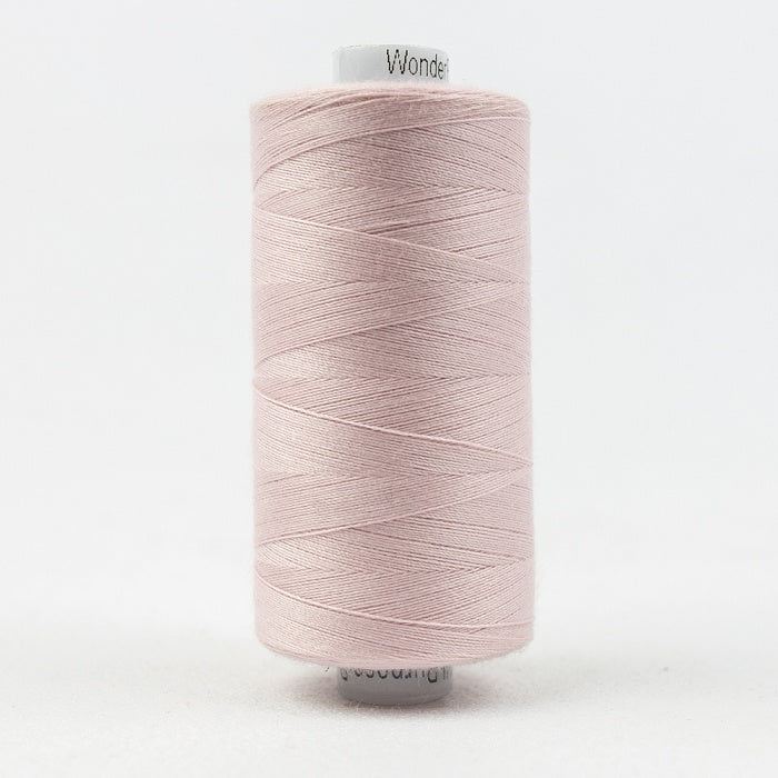 Spool of pale pink thread with Designer branding.