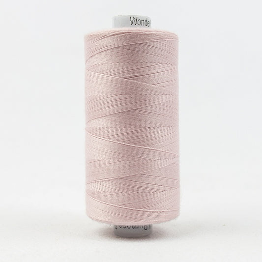 Spool of pale pink thread with Designer branding.