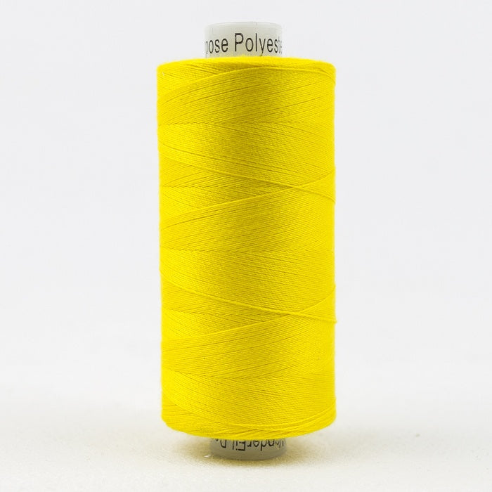 Spool of yellow thread with Designer branding.
