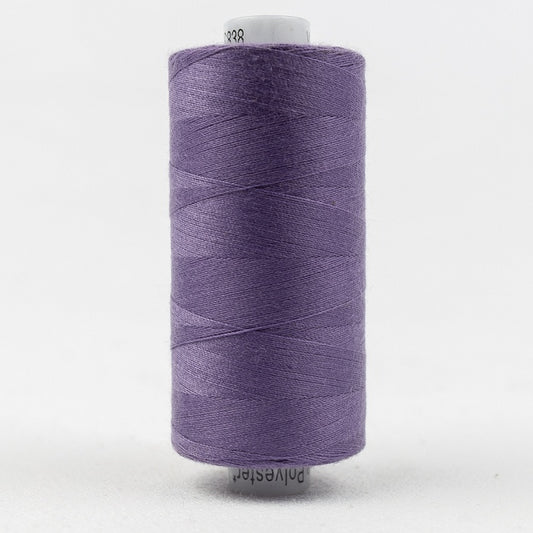 Spool of purple thread with Designer branding.