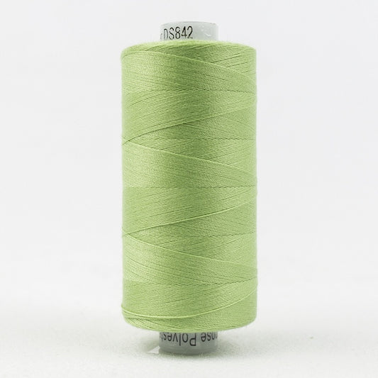 Spool of pale green thread with Designer branding.
