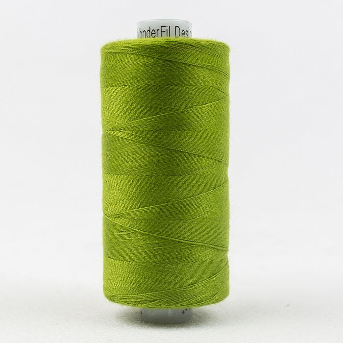 Spool of green thread with Designer branding.