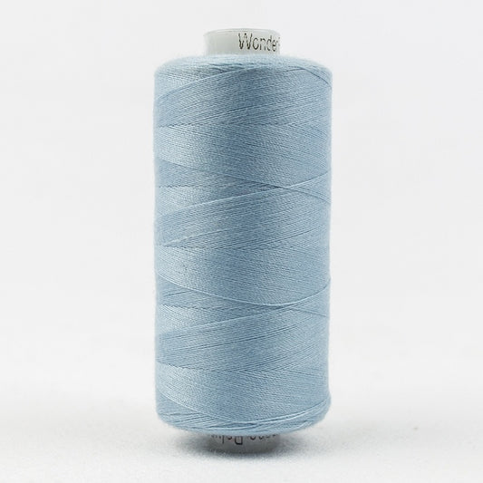 Spool of light blue thread with Designer branding.