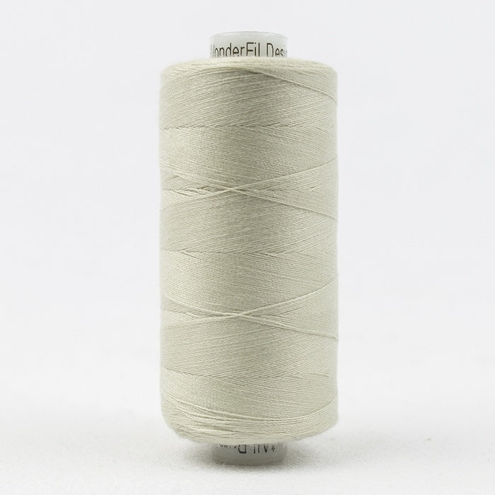 Spool of palest cream thread with Designer branding.