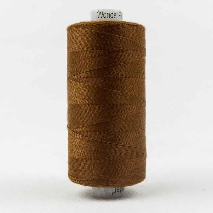 Spool of brown thread with Designer branding.